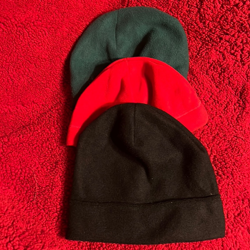 Women’s Kelly green hat. One red beanie. One black beanie. Sold together.